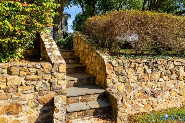a view of water heater room with wooden floor