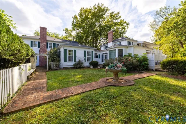 a view of a house with a yard porch and sitting area