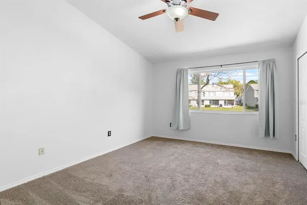 a view of a room that has a large window