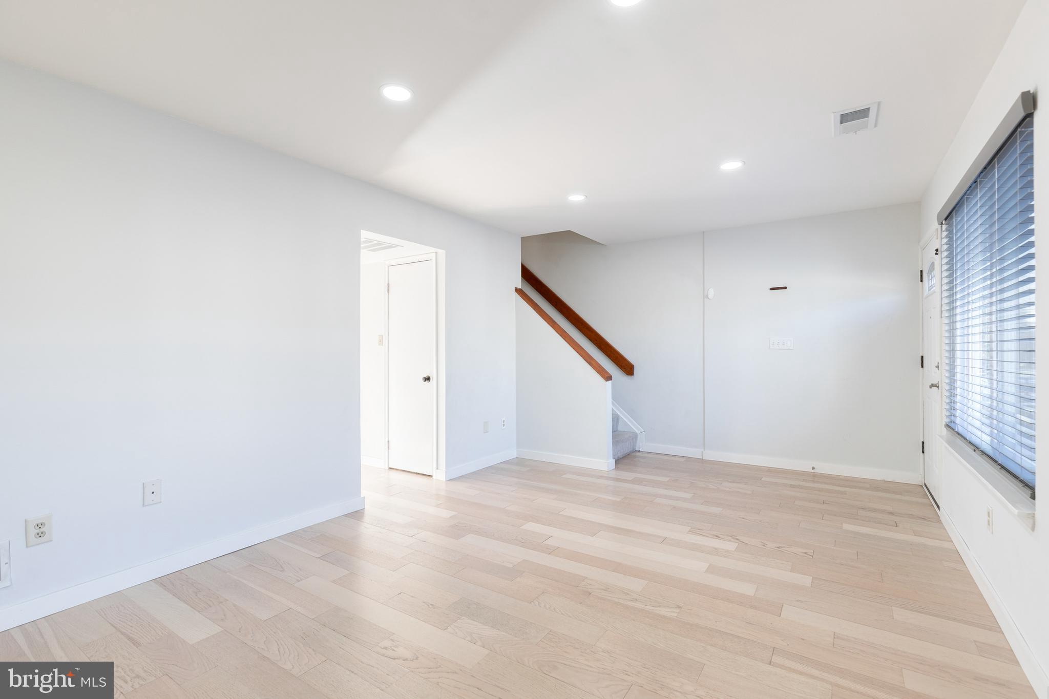 1615 Fendall Court Crofton, MD 21114 - Photo 4 of 16 an empty room with windows and stairs