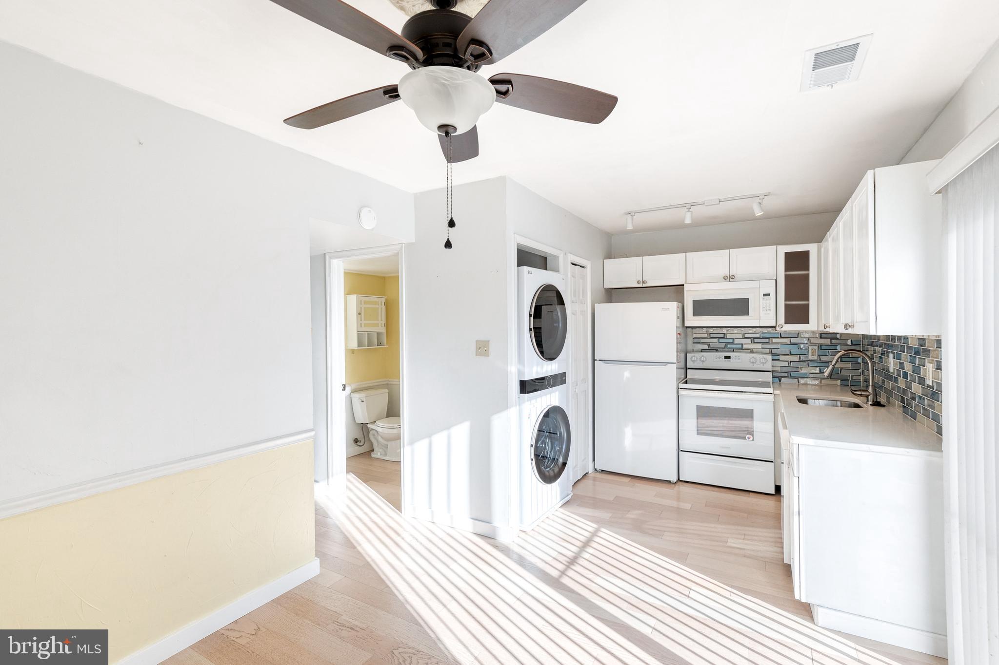 1615 Fendall Court Crofton, MD 21114 - Photo 5 of 16 a kitchen with stainless steel appliances a refrigerator and a stove
