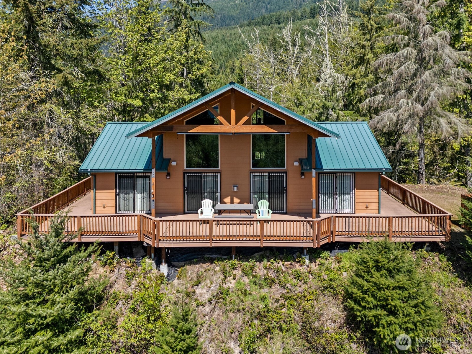 0 Boyd Road Randle, WA 98377 - Photo 3 of 39 a front view of a house with a yard and balcony