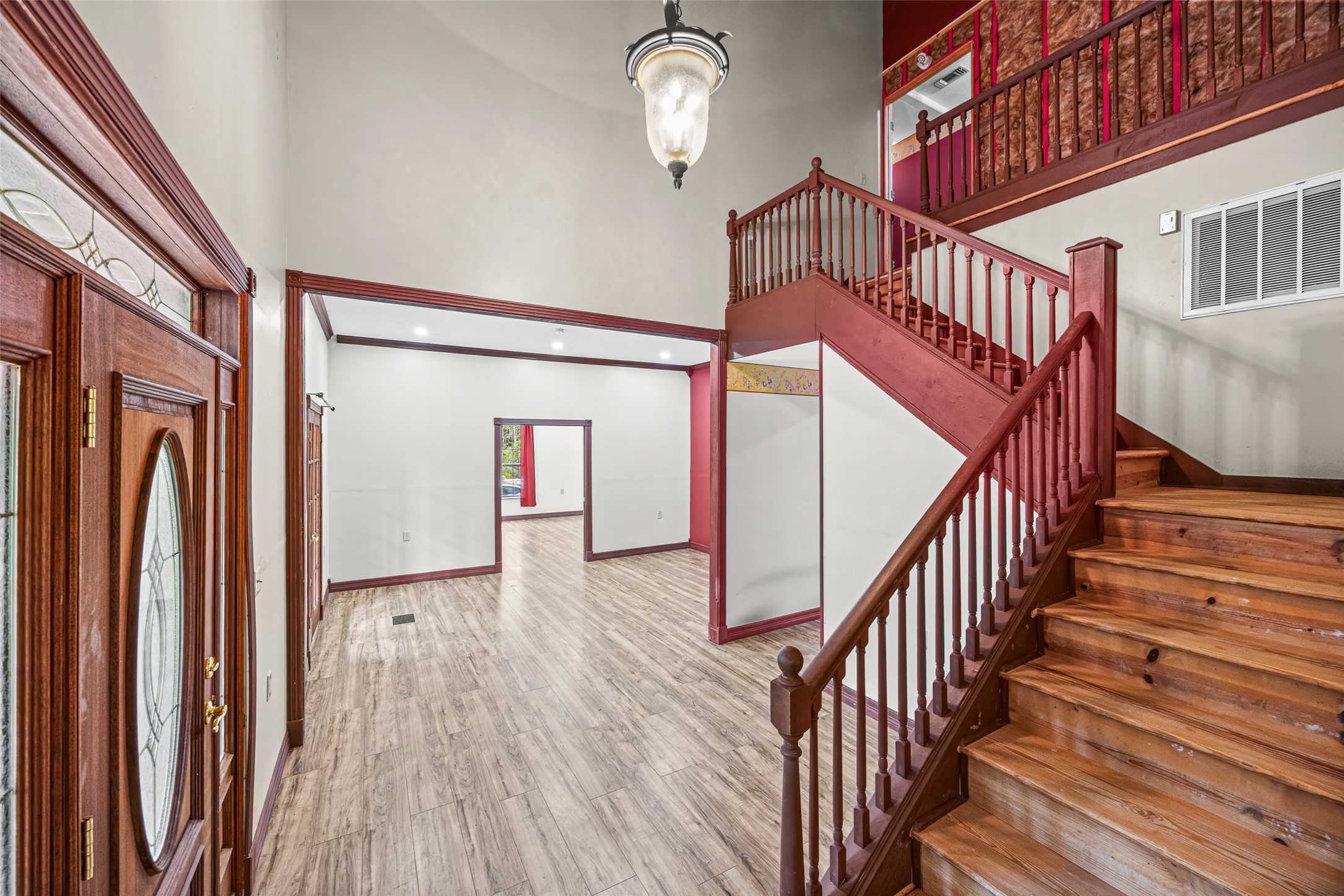 7 Northwood Country Road Huffman, TX 77336 - Photo 9 of 50 a view of staircase with lots of frames on wall and wooden floor