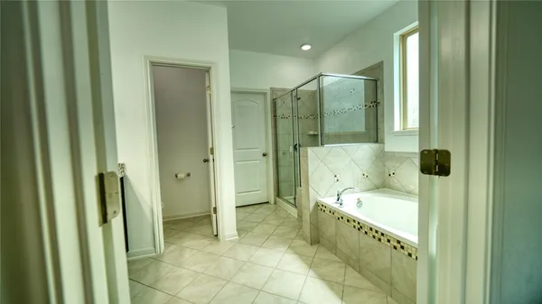 a bathroom with a granite countertop sink toilet and a mirror