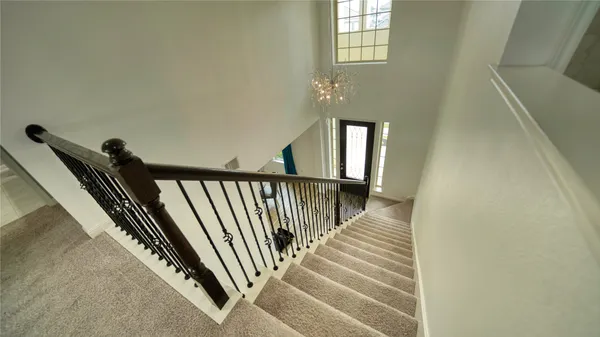 a view of a dining room with furniture and window