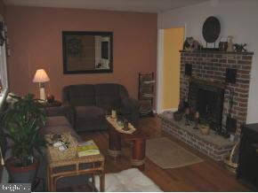 25 North Island Road Bayville, NJ 08721 - Photo 4 of 5 a living room with furniture and a fireplace