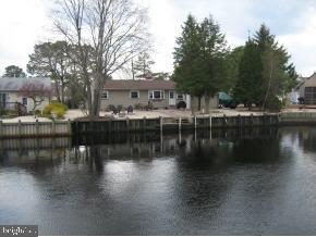 25 North Island Road Bayville, NJ 08721 - Photo 5 of 5 a view of residential house with outdoor space and lake