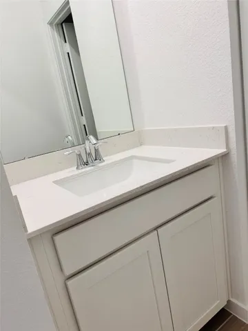 an entryway of a house and an empty room