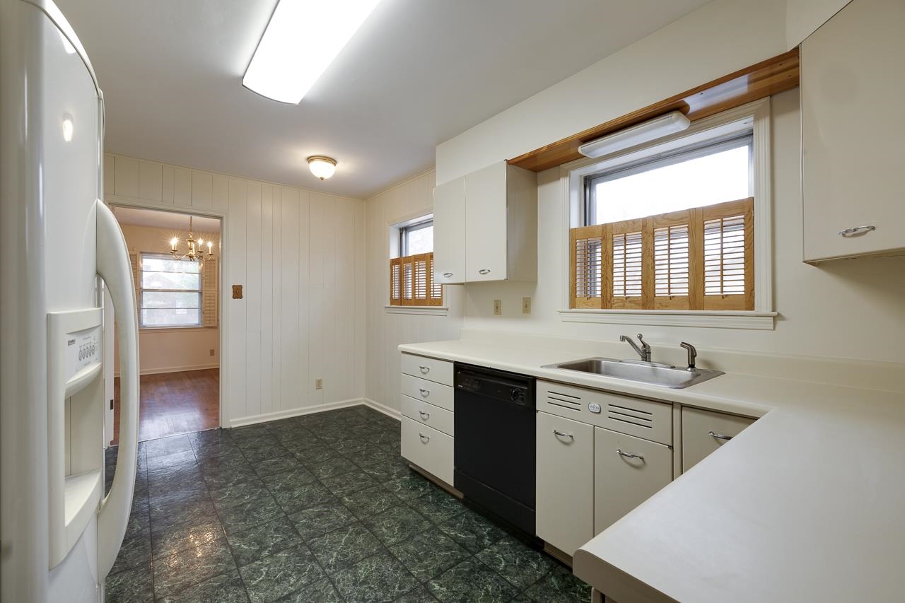 5673 Normandy Road Memphis, TN 38120 - Photo 13 of 39 a kitchen with a sink and cabinets