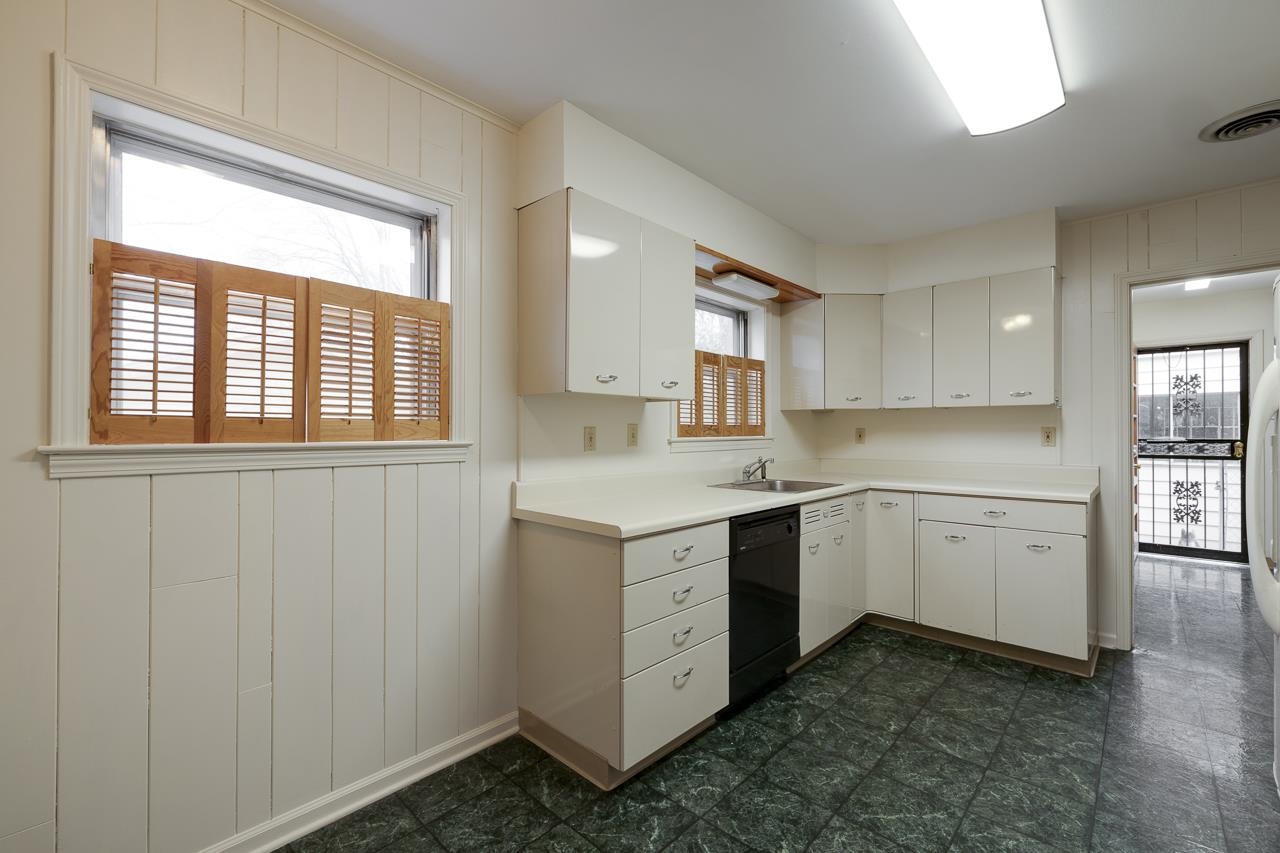 5673 Normandy Road Memphis, TN 38120 - Photo 17 of 39 a kitchen with sink cabinets and window