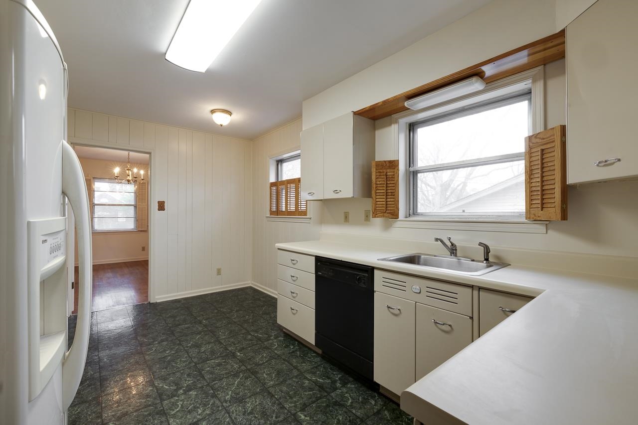 5673 Normandy Road Memphis, TN 38120 - Photo 20 of 39 a kitchen with a sink and a refrigerator