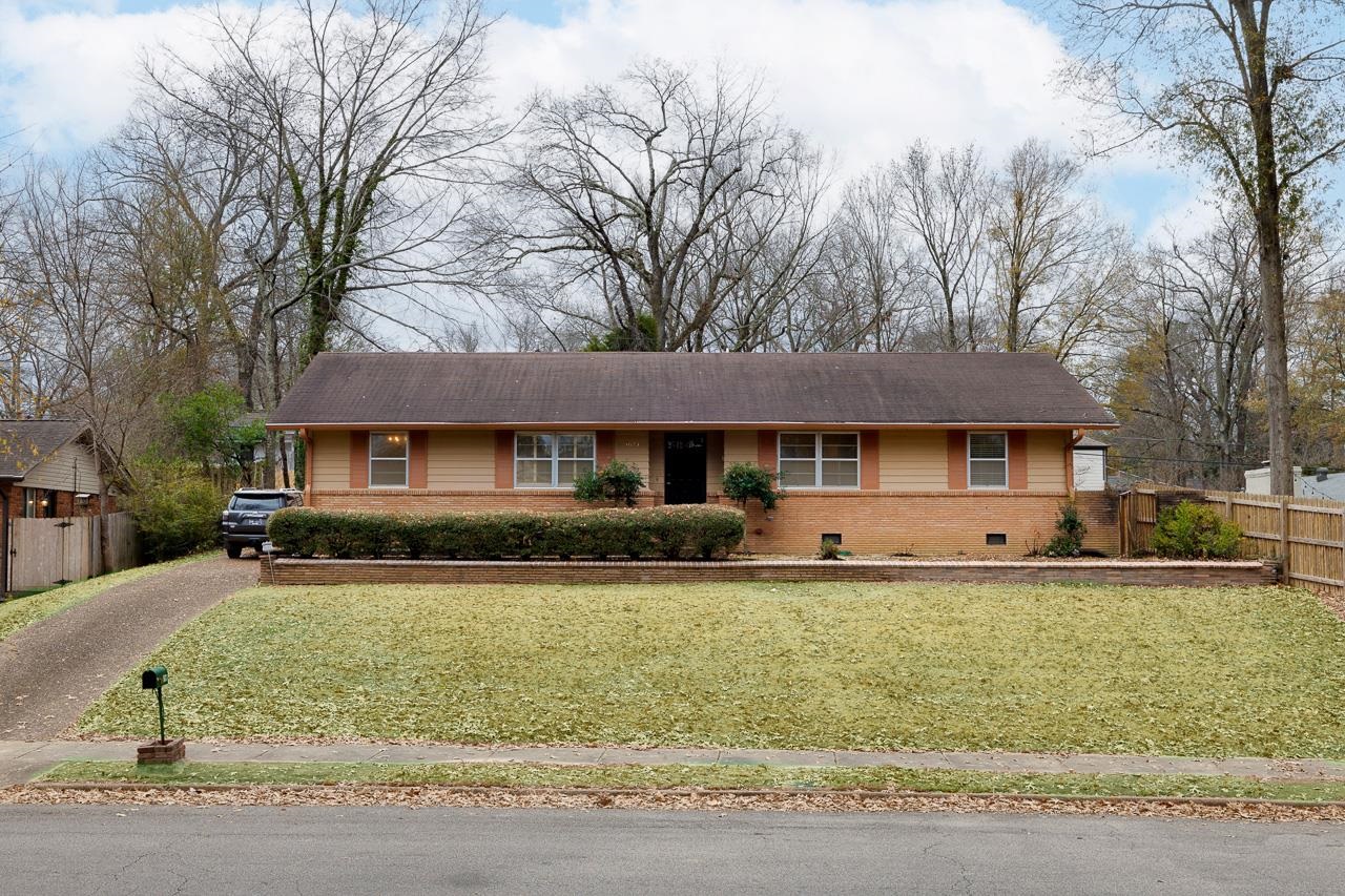 5673 Normandy Road Memphis, TN 38120 - Photo 2 of 39 a front view of a house with a yard