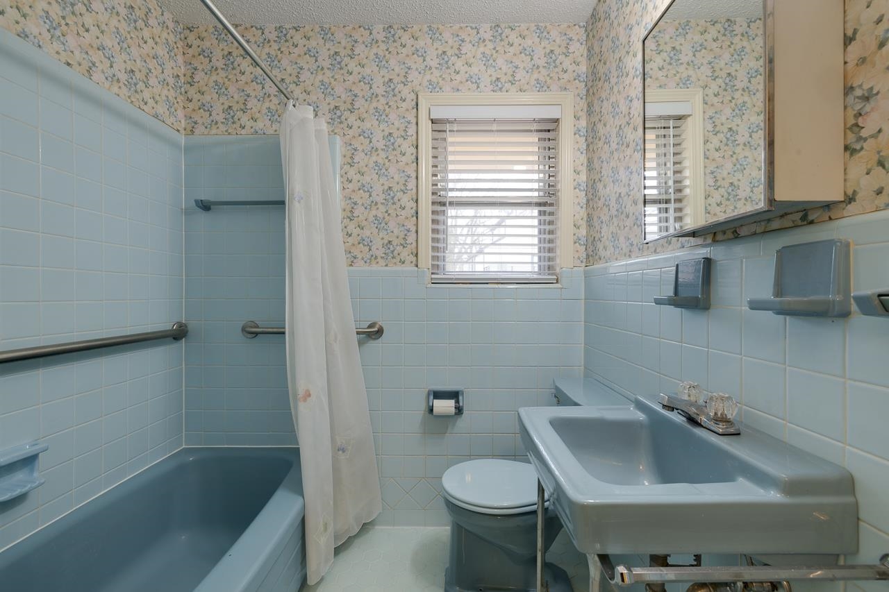 5673 Normandy Road Memphis, TN 38120 - Photo 22 of 39 a bathroom with a sink and toilet
