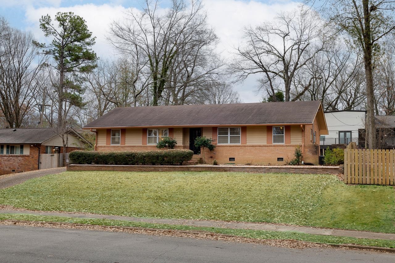 5673 Normandy Road Memphis, TN 38120 - Photo 3 of 39 a front view of a house with a yard