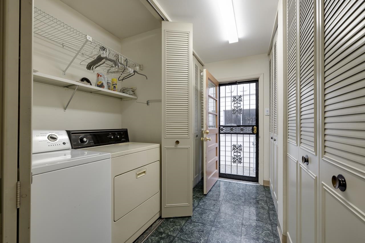 5673 Normandy Road Memphis, TN 38120 - Photo 31 of 39 a view of washer and dryer with bathroom in the background