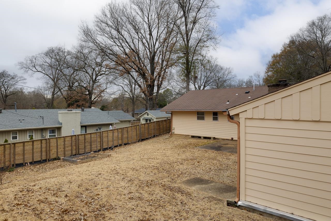 5673 Normandy Road Memphis, TN 38120 - Photo 33 of 39 a view of a house with wooden fence