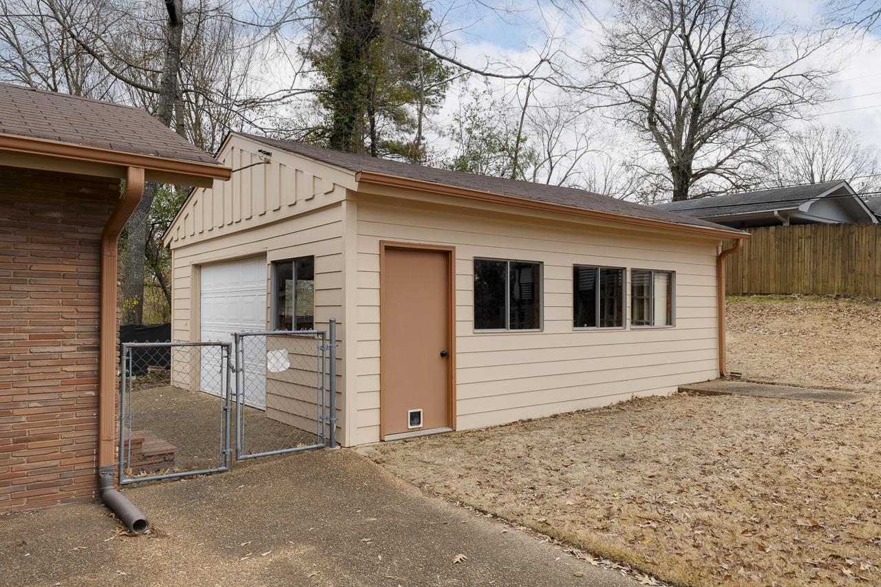 5673 Normandy Road Memphis, TN 38120 - Photo 35 of 39 a view of a house with a yard