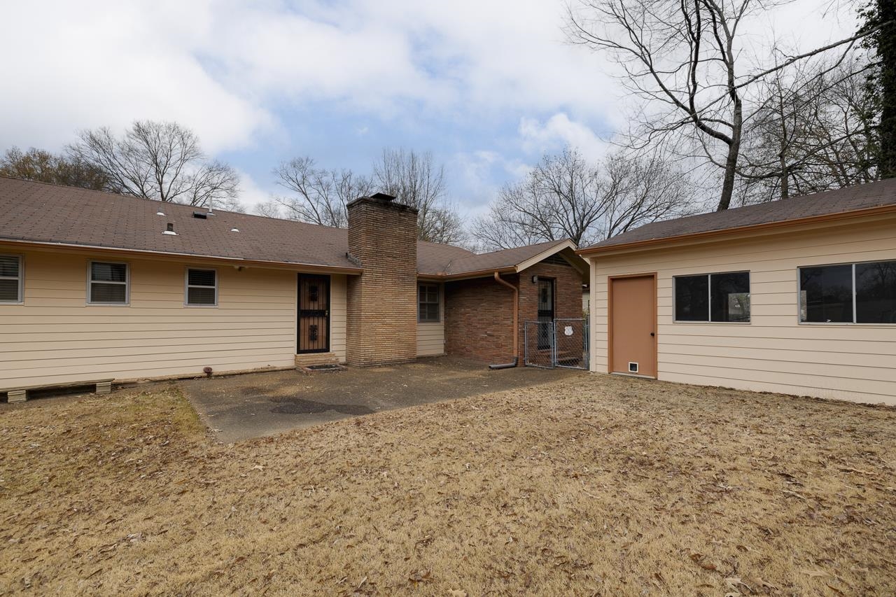 5673 Normandy Road Memphis, TN 38120 - Photo 36 of 39 a house with trees in the background