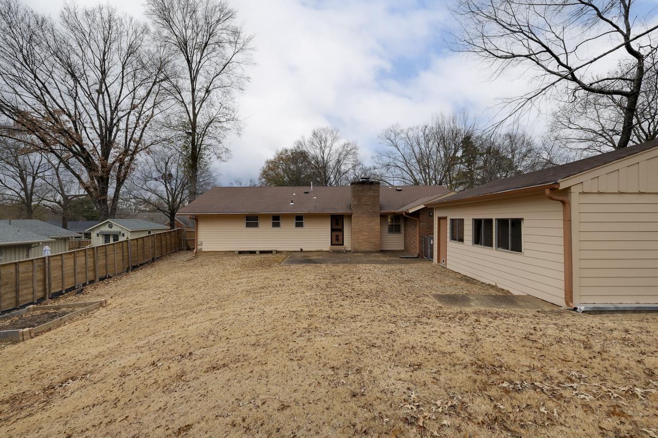 5673 Normandy Road Memphis, TN 38120 - Photo 39 of 39 a front view of a house with a yard and garage
