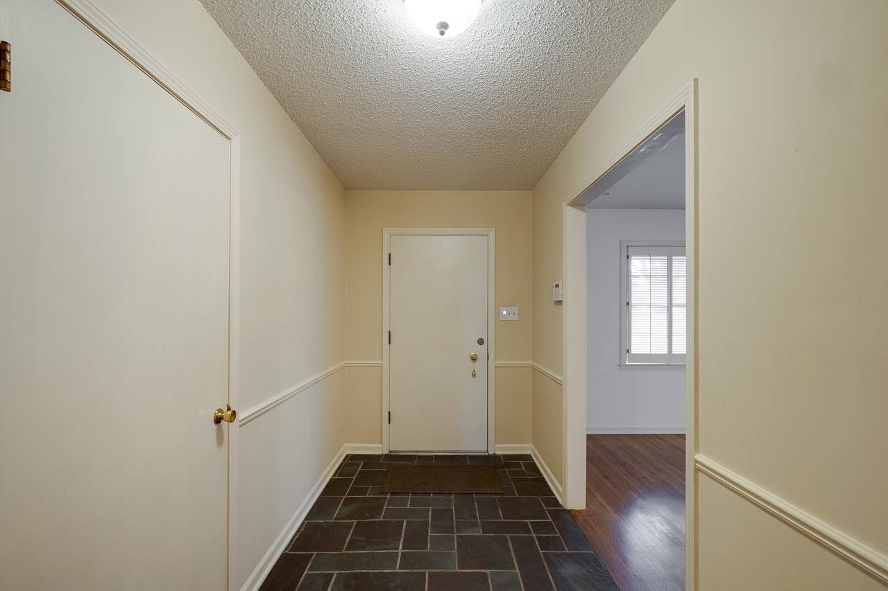 5673 Normandy Road Memphis, TN 38120 - Photo 5 of 39 a view of a livingroom from a hallway