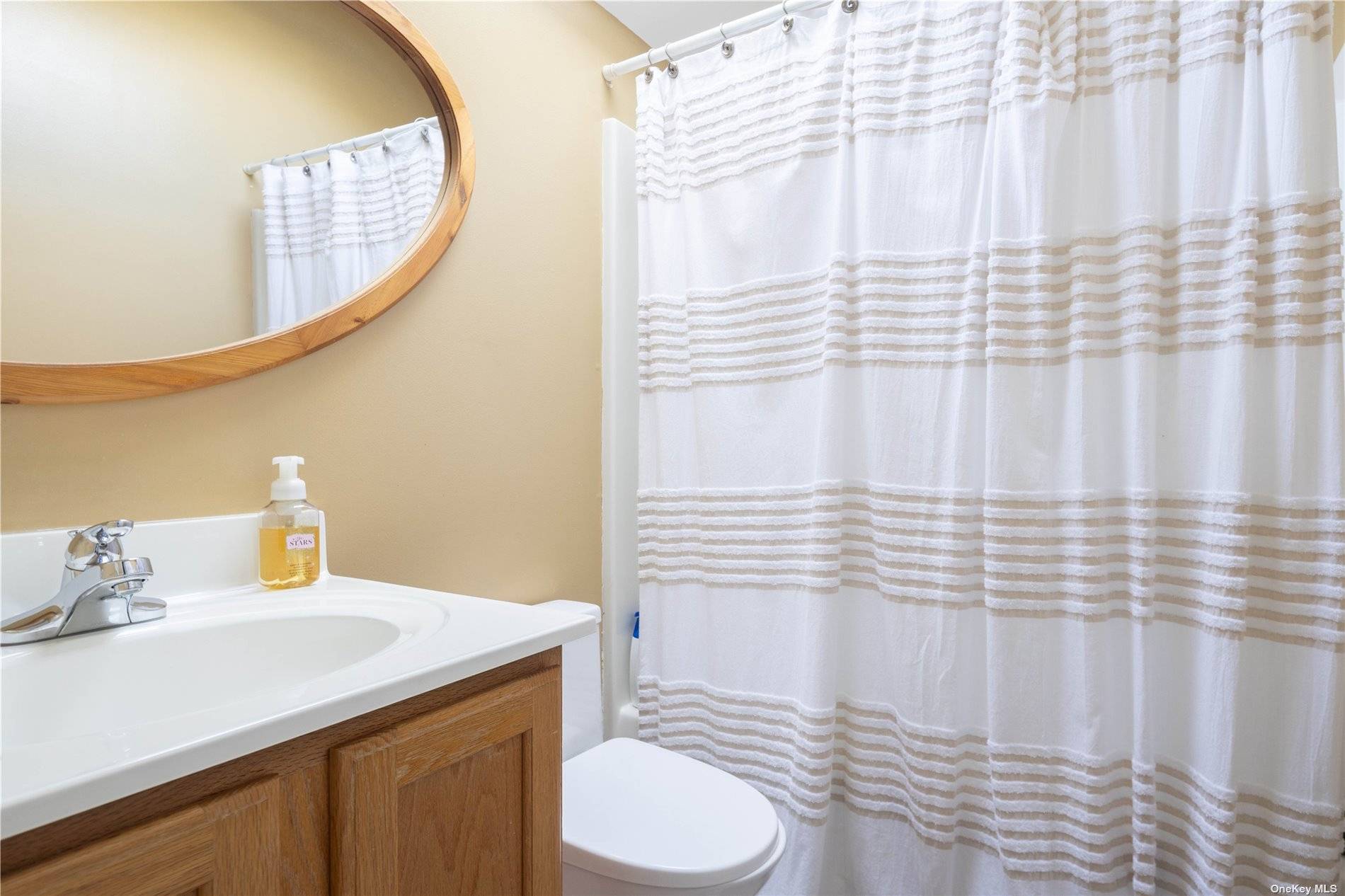 115 Cliff Road Wading River, NY 11792 - Photo 18 of 28 a bathroom with a sink and a mirror