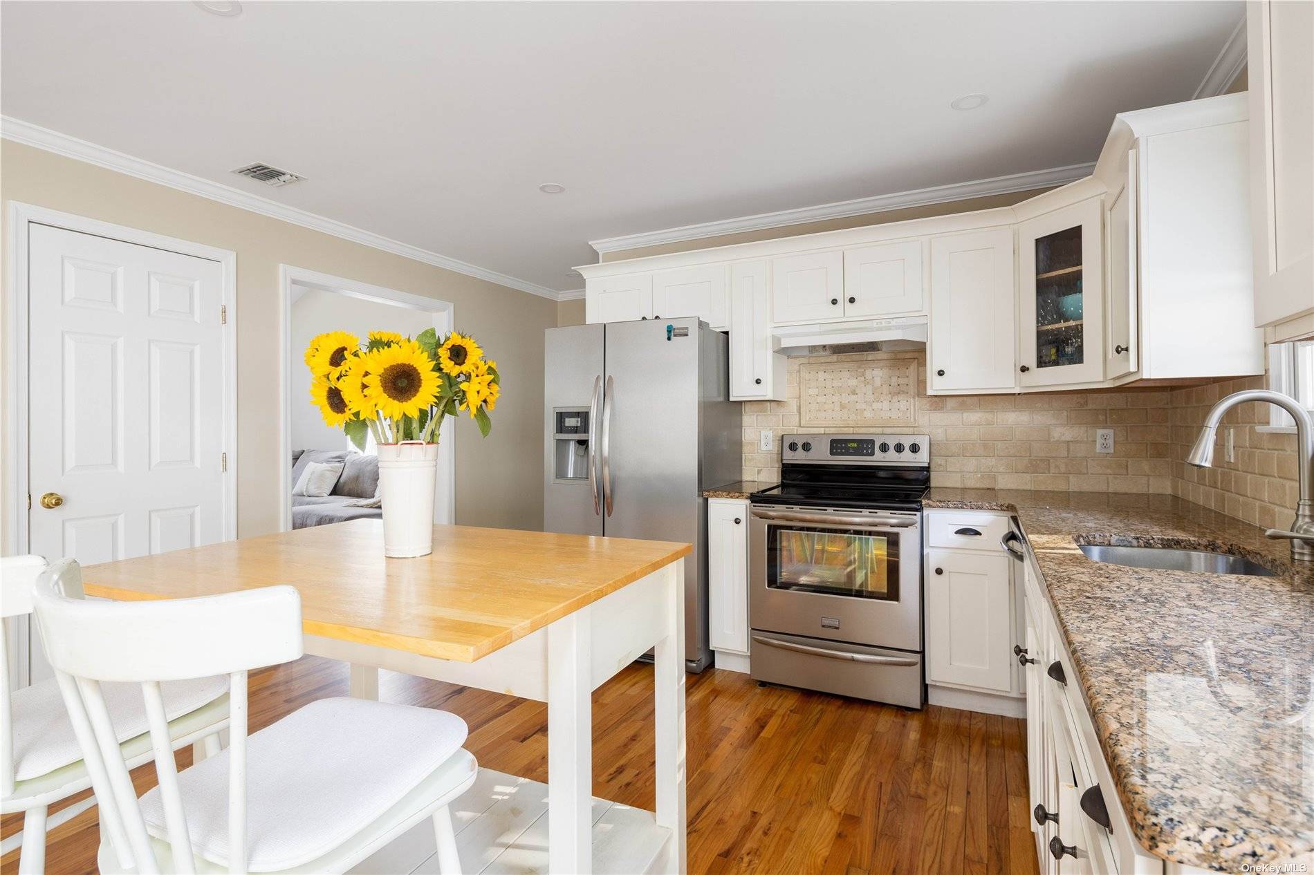 115 Cliff Road Wading River, NY 11792 - Photo 5 of 28 a kitchen with granite countertop a refrigerator stove top oven and sink