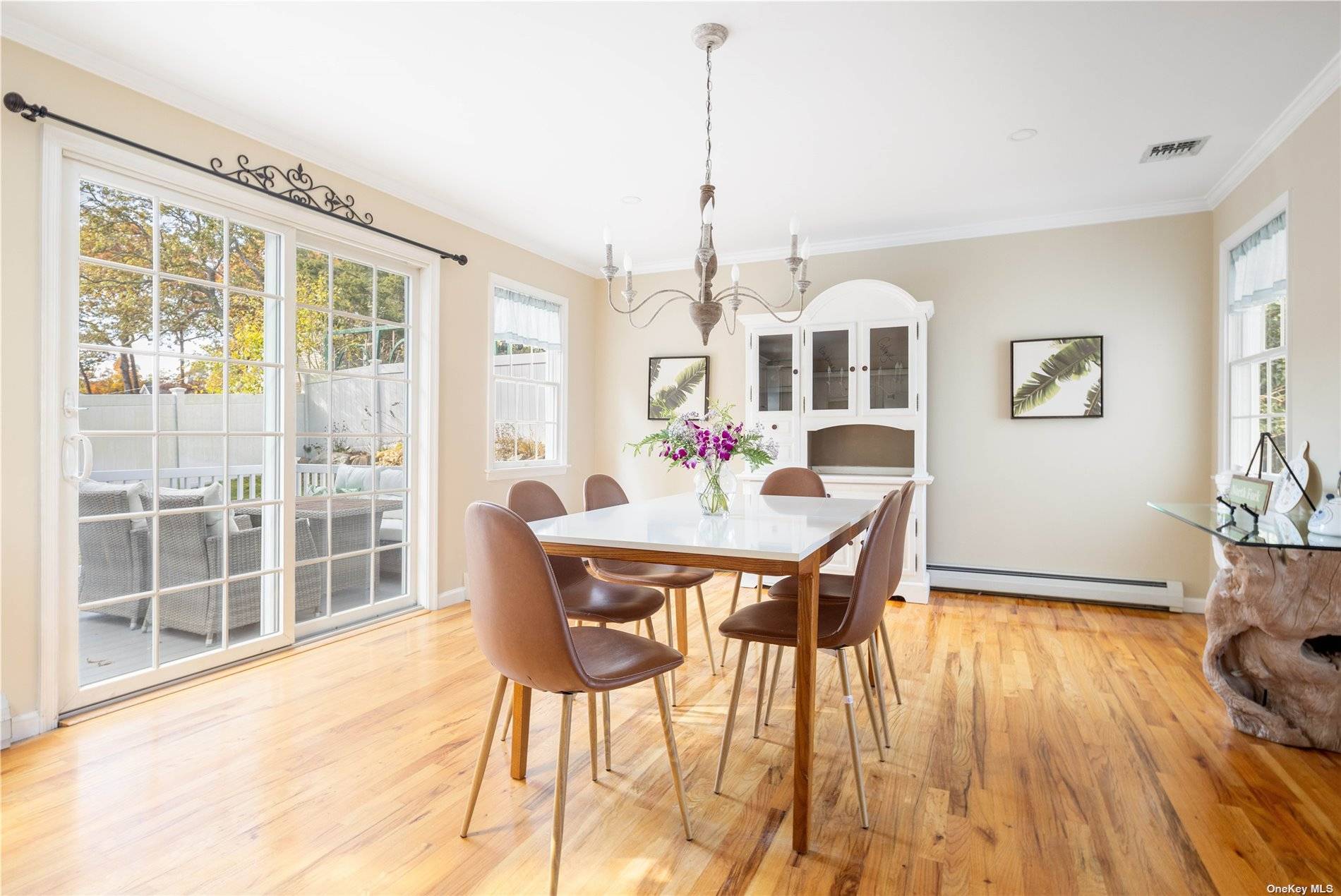 115 Cliff Road Wading River, NY 11792 - Photo 7 of 28 a view of a dining room with furniture window and wooden floor
