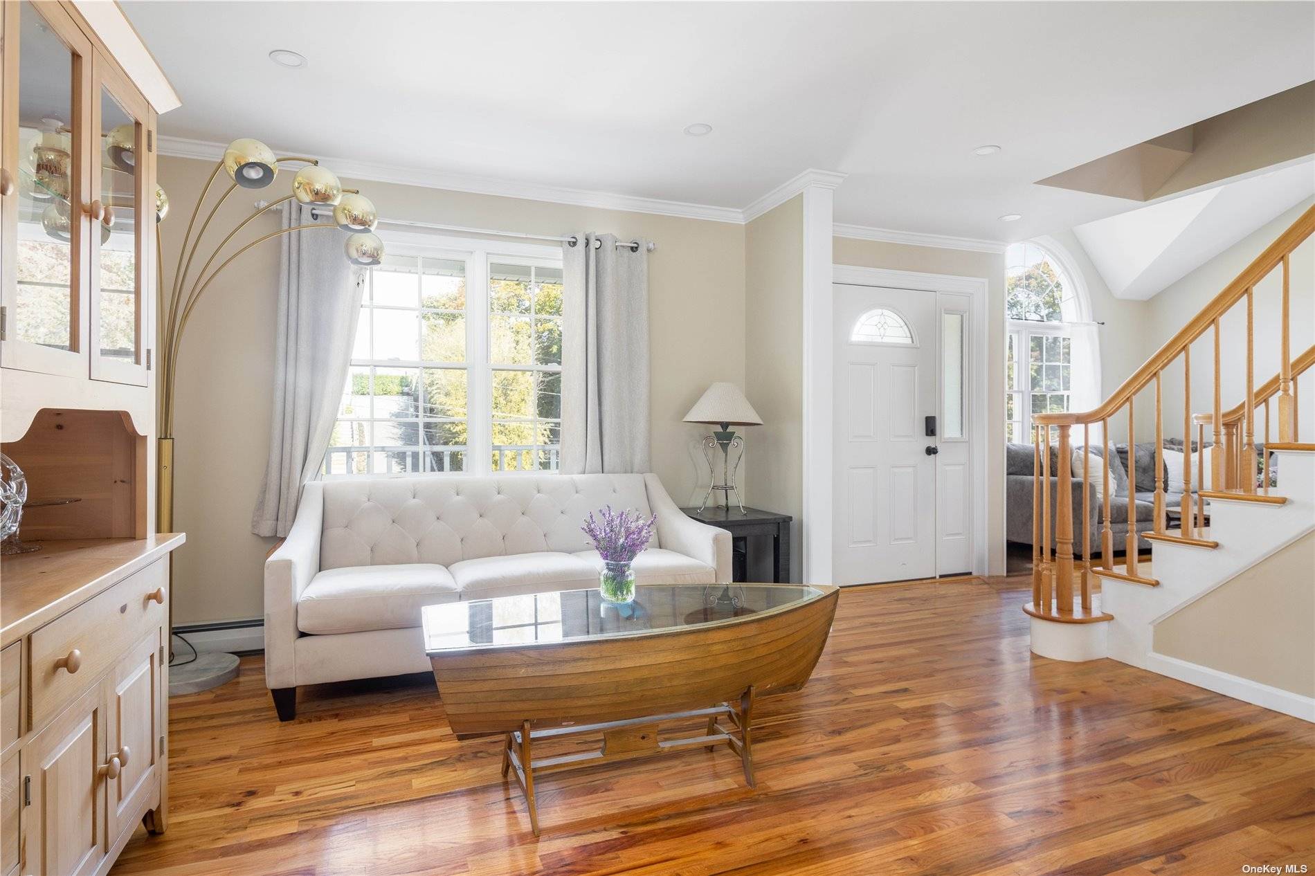 115 Cliff Road Wading River, NY 11792 - Photo 8 of 28 a living room with furniture and a wooden floor
