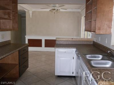 18453 Iris Road Fort Myers, FL 33967 - Photo 5 of 10 a kitchen with a sink and cabinets
