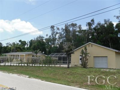 18453 Iris Road Fort Myers, FL 33967 - Photo 8 of 10 a view of a house with a yard