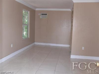 18453 Iris Road Fort Myers, FL 33967 - Photo 9 of 10 a view of an empty room with window and closet area