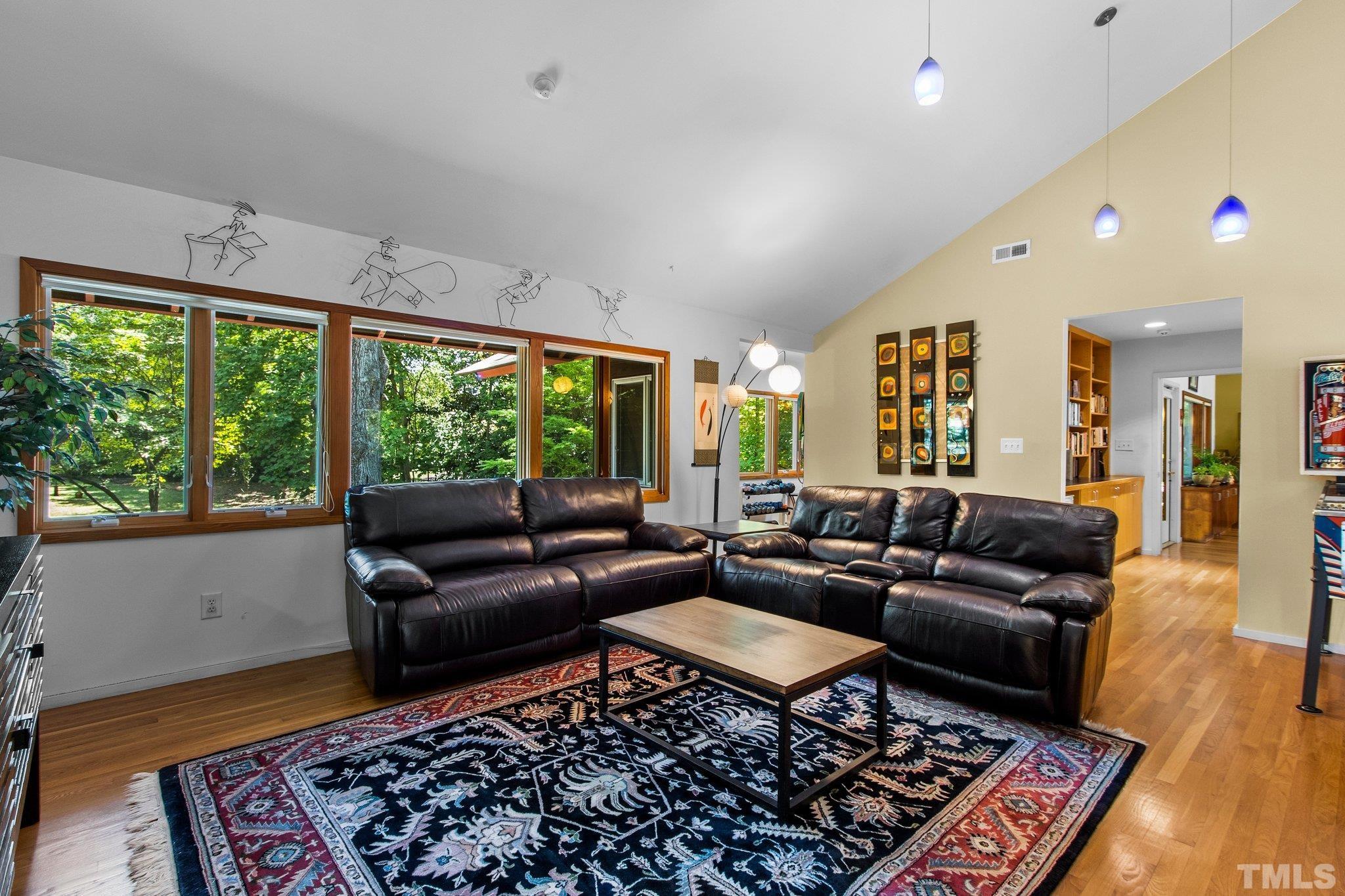 2700 Webb Street Raleigh, NC 27609 - Photo 35 of 60 a living room with furniture and a rug