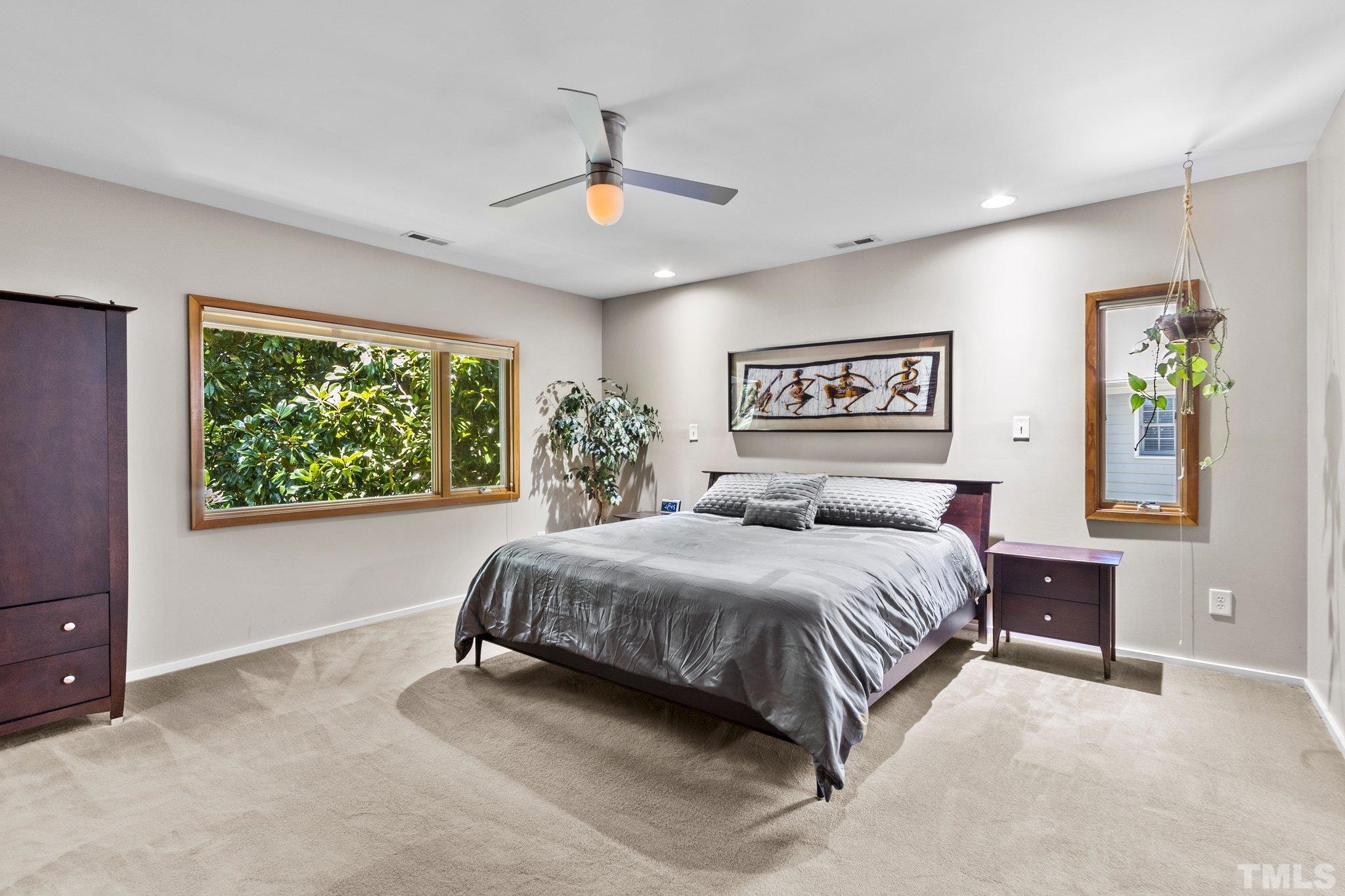 2700 Webb Street Raleigh, NC 27609 - Photo 42 of 60 a spacious bedroom with a large bed and a window