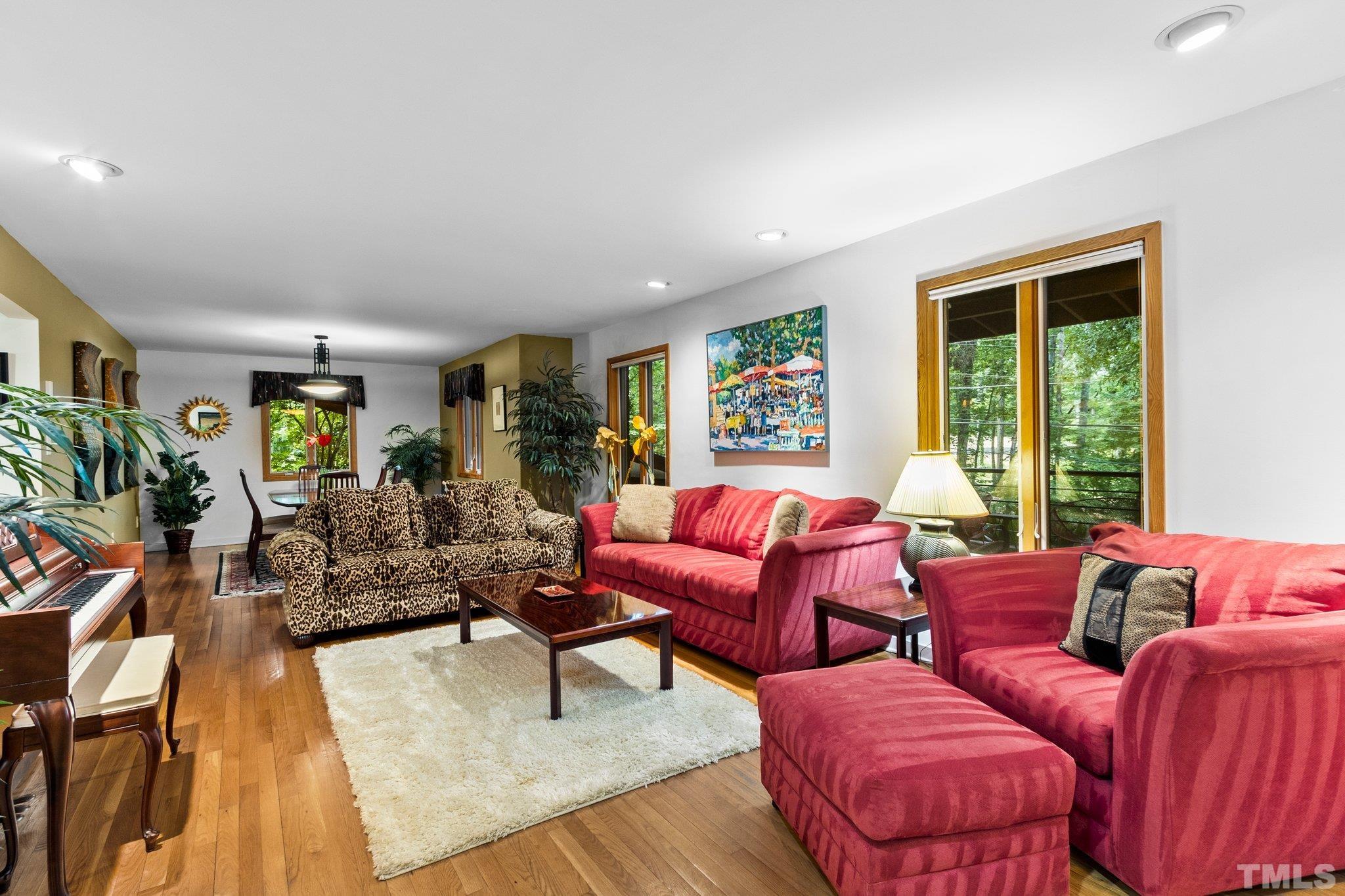 2700 Webb Street Raleigh, NC 27609 - Photo 8 of 60 a living room with furniture wooden floor and a large window
