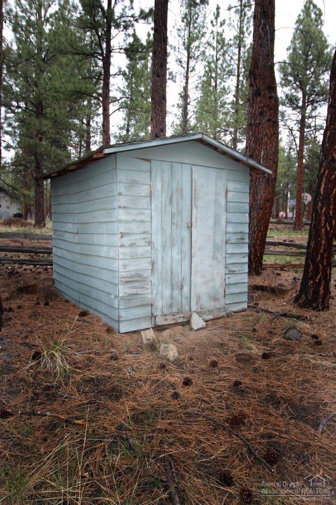 16102 Old Juniper Road Sisters, OR 97759 - Photo 18 of 20 Storage building for bikes, rakes, sleds