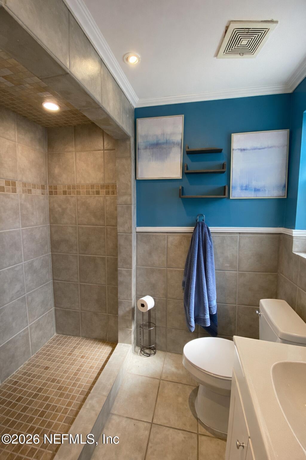 6400 Diane Road Jacksonville, FL 32277 - Photo 12 of 16 a bathroom with a toilet and a shower