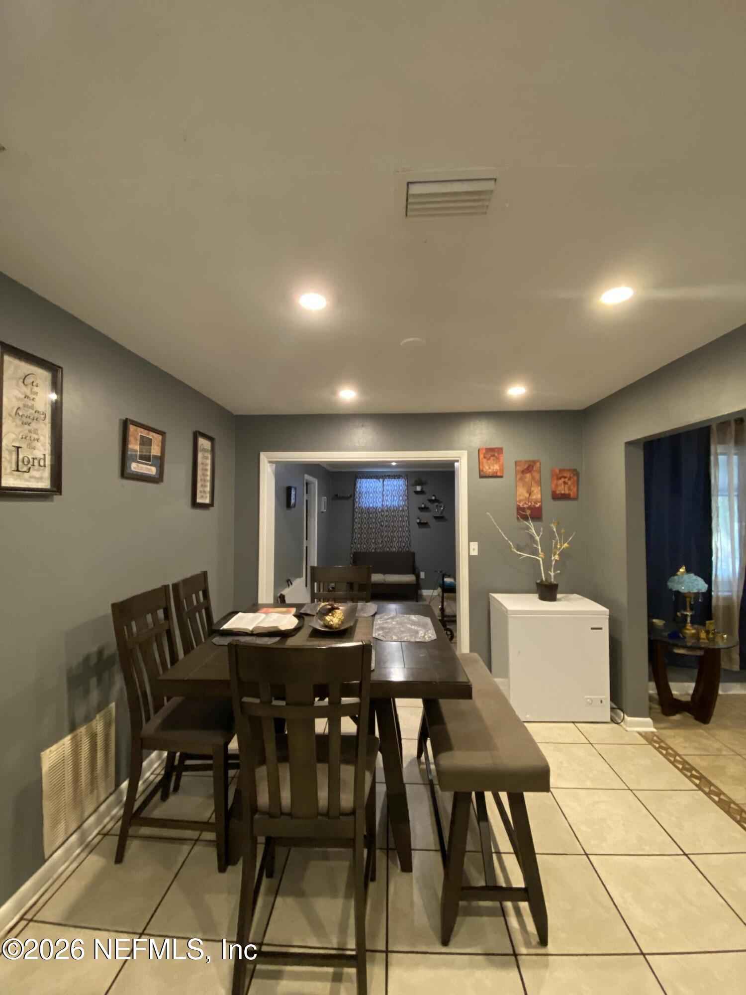 6400 Diane Road Jacksonville, FL 32277 - Photo 4 of 16 a view of a dining room with furniture