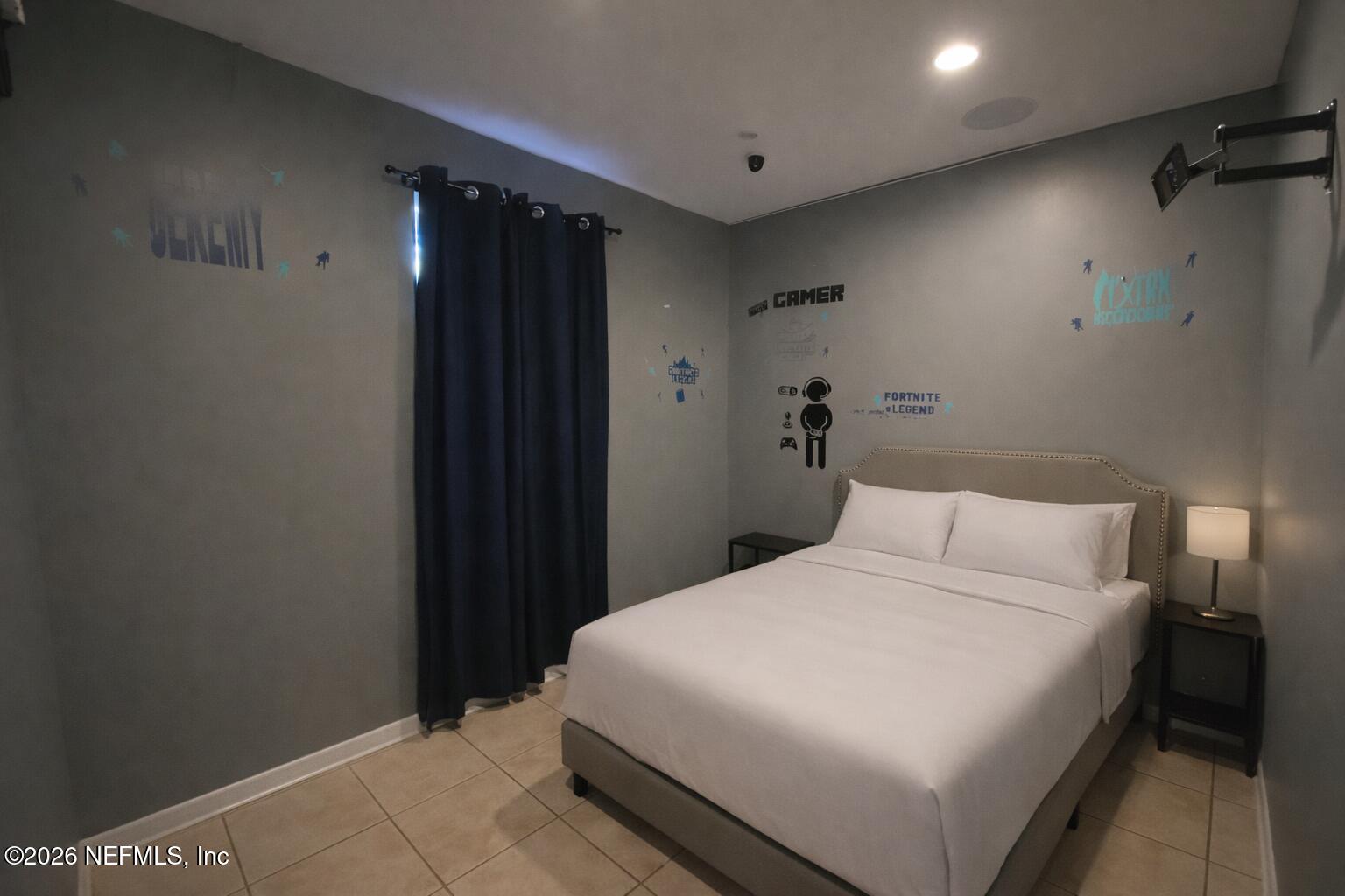 6400 Diane Road Jacksonville, FL 32277 - Photo 9 of 16 a bedroom with a bed and a wall painting