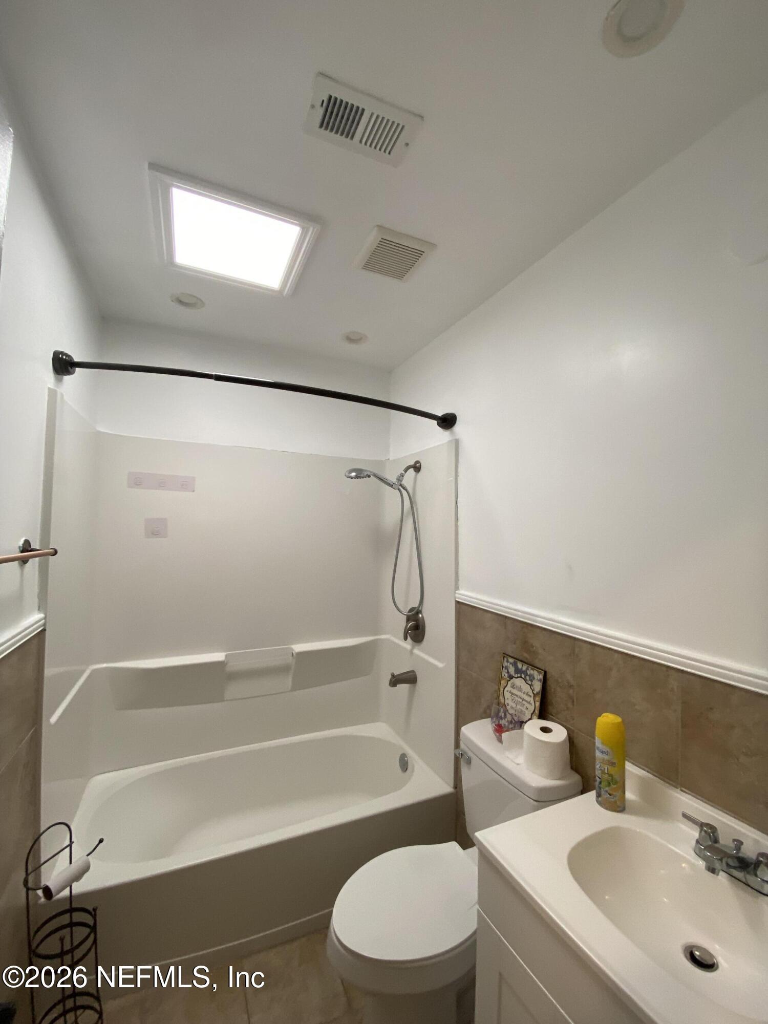 6400 Diane Road Jacksonville, FL 32277 - Photo 10 of 16 a bathroom with a sink toilet and shower