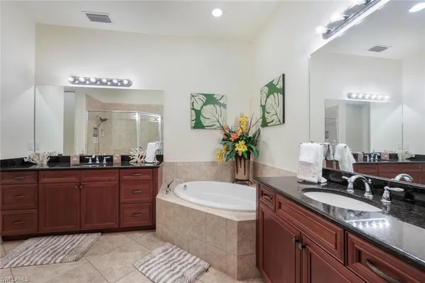 a bath room with a sink and a mirror