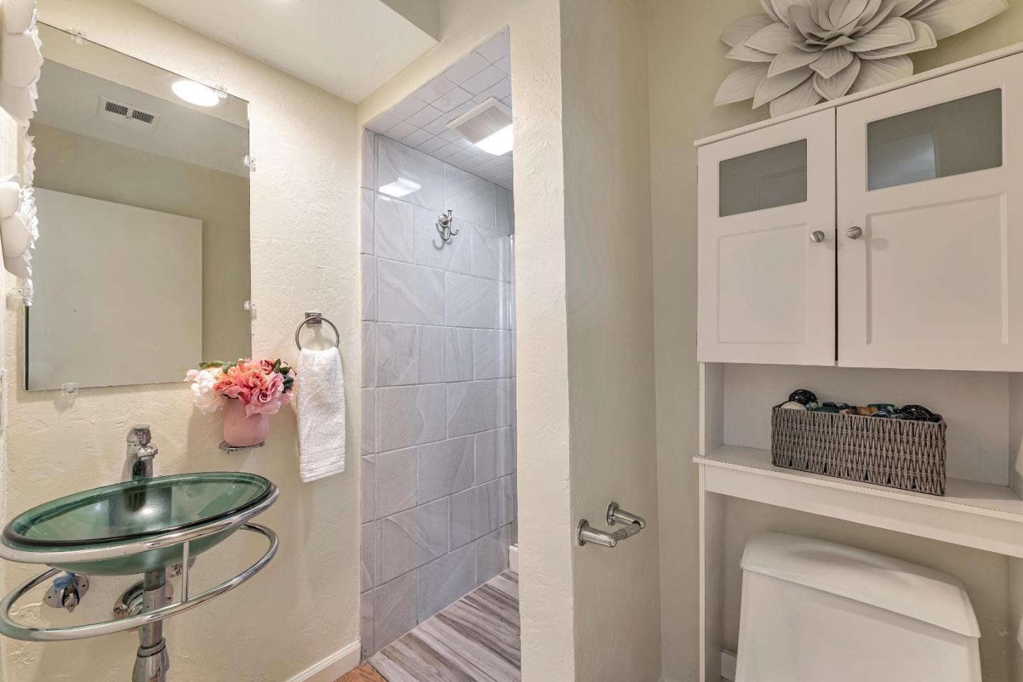 175 Violet Road Hercules, CA 94547 - Photo 23 of 35 a bathroom with a sink and a mirror