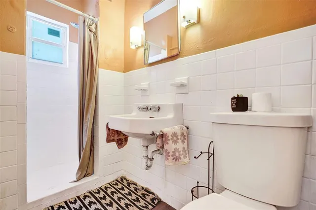 a bathroom with a sink and mirror