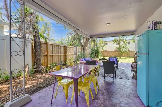 a view of a dining room with furniture window and outside view