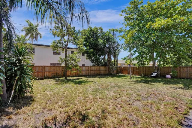 a house with a tree in front of it