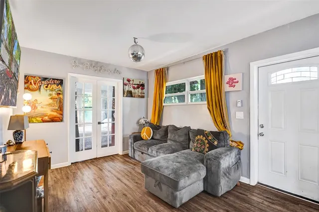 a living room with furniture and a window