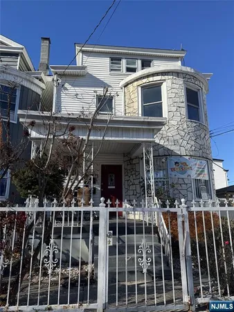 a front view of a house with glass windows