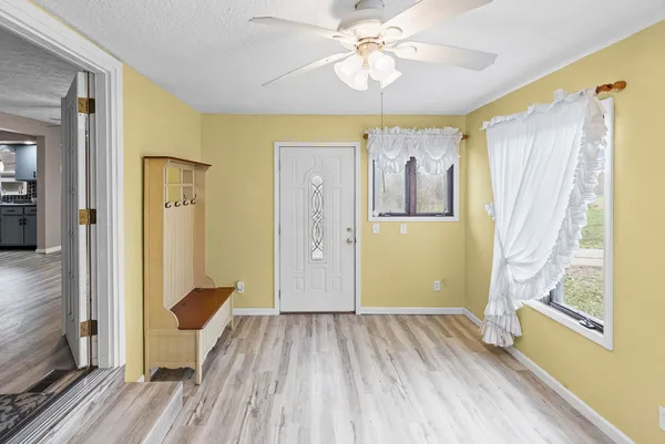 a view of a kitchen cabinets and wooden floor
