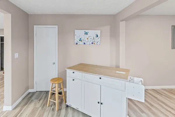 a stove top oven sitting inside of a kitchen