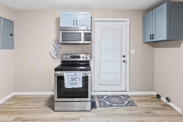 a kitchen with stainless steel appliances granite countertop a stove and a sink