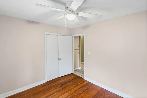 an aerial view of residential house with beach and trees